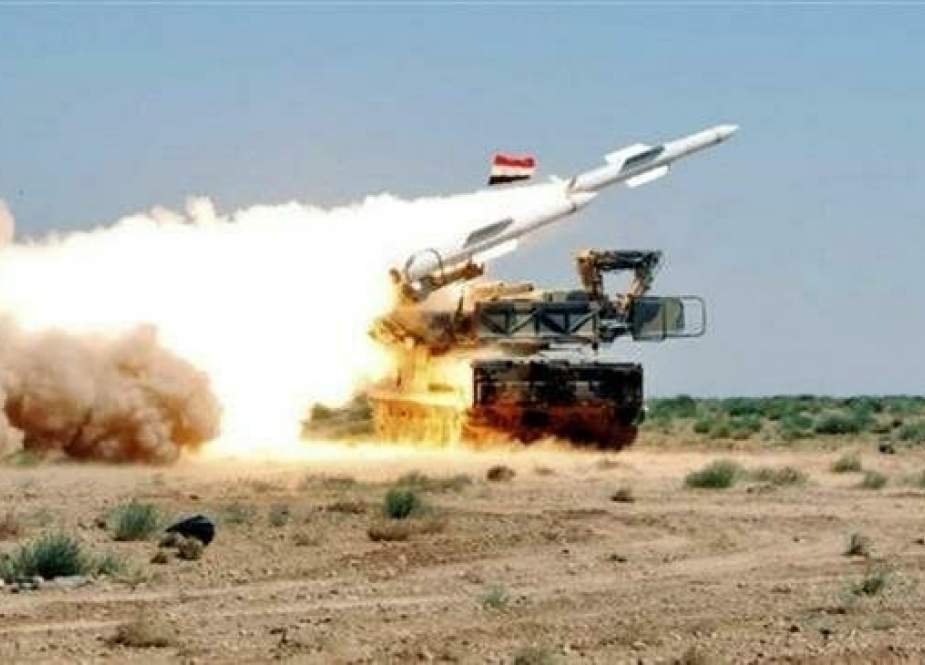 The file photo shows a Syrian air defense battery in action.