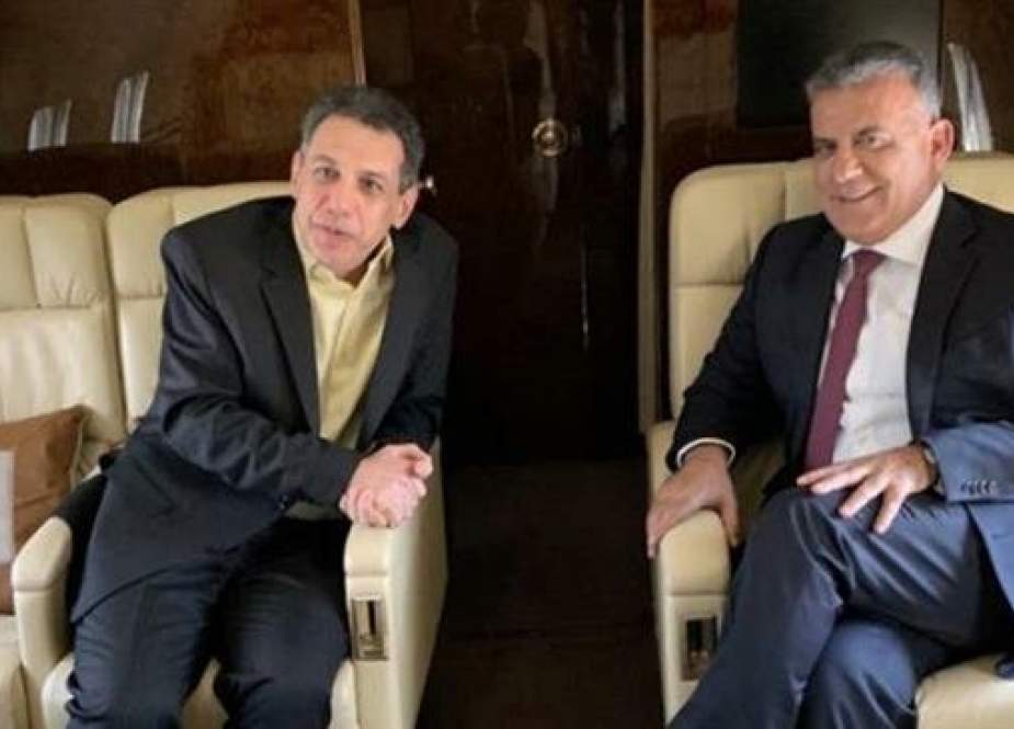 A handout picture released by Lebanese General Directorate of General Security on June 11, 2019 shows General Security chief Abbas Ibrahim (R) onboard a plane with Nizar Zakka as they make their way to Beirut. (Via AFP)