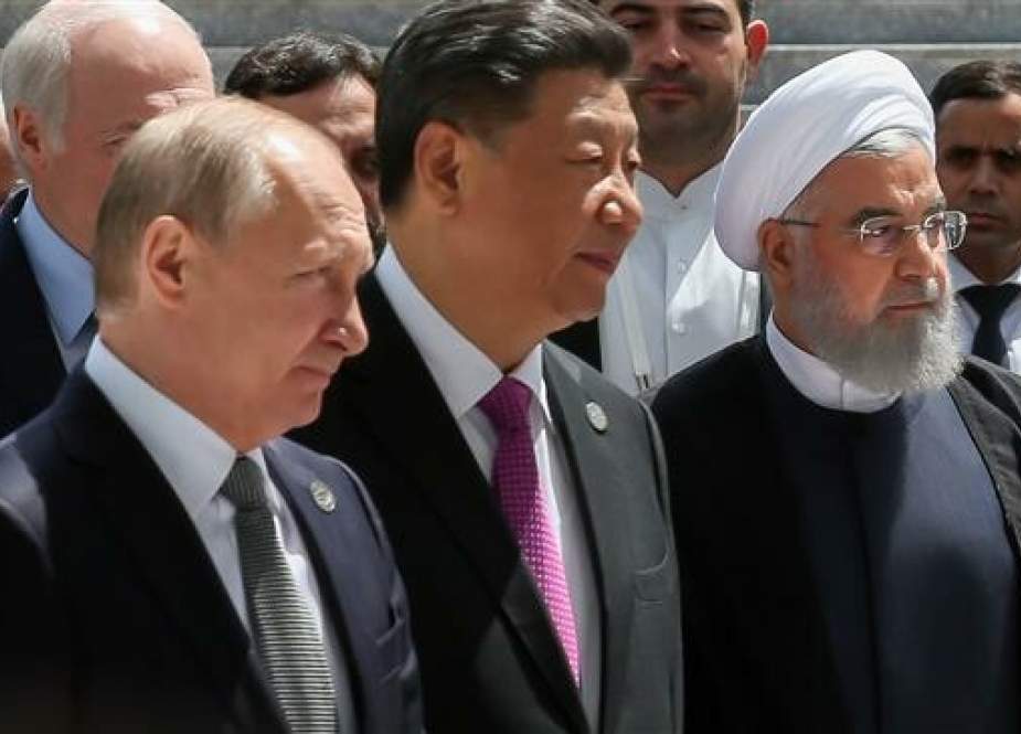Iranian President Hassan Rouhani (right), Chinese President Xi Jinping (center), and Russian President Vladimir Putin (left) pose for a photo after the 19th summit of the leaders of the Shanghai Cooperation Organization (SCO) in Bishkek, Kyrgyzstan, on June 14, 2019. (Photo by president.ir)