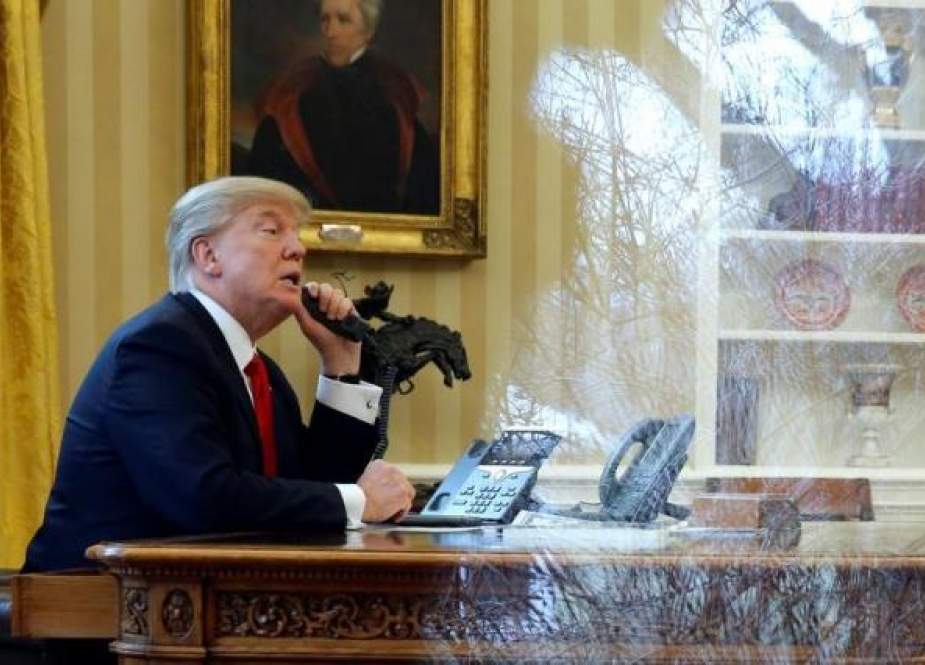 U.S. President Donald Trump waits to speak by phone.jpg