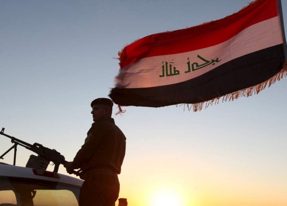 Iraqi security forces stands guard during a border patrol.JPG