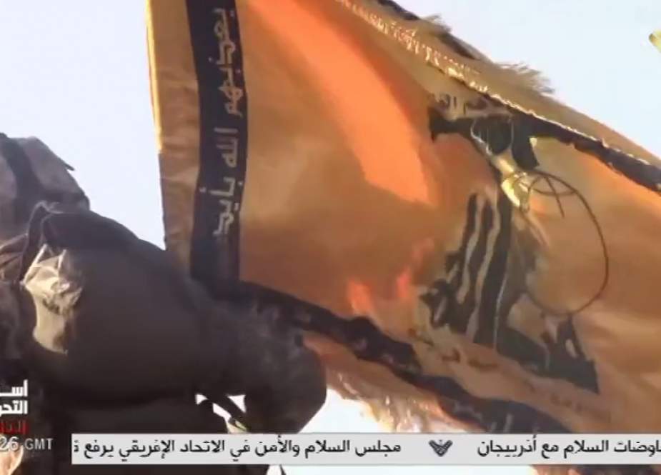 Hezbollah militia and its flag.jpg