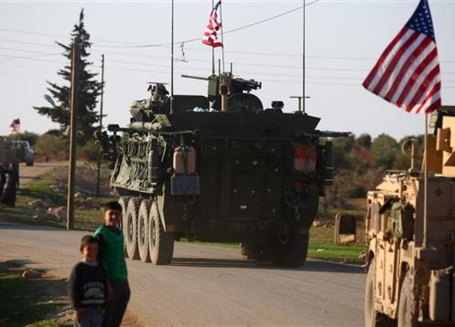 US forces armored vehicles drives near the village of Yalanli, northern Syrian city of Manbij.jpg