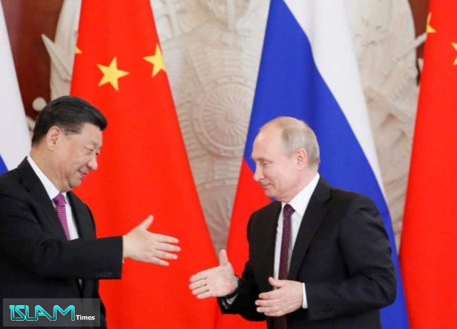 Russia Urges China to ’Team up’ against West’s Unfriendly Actions