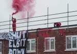 Juru Kampanye Naik ke Atap Pabrik Drone yang Digunakan Militer 