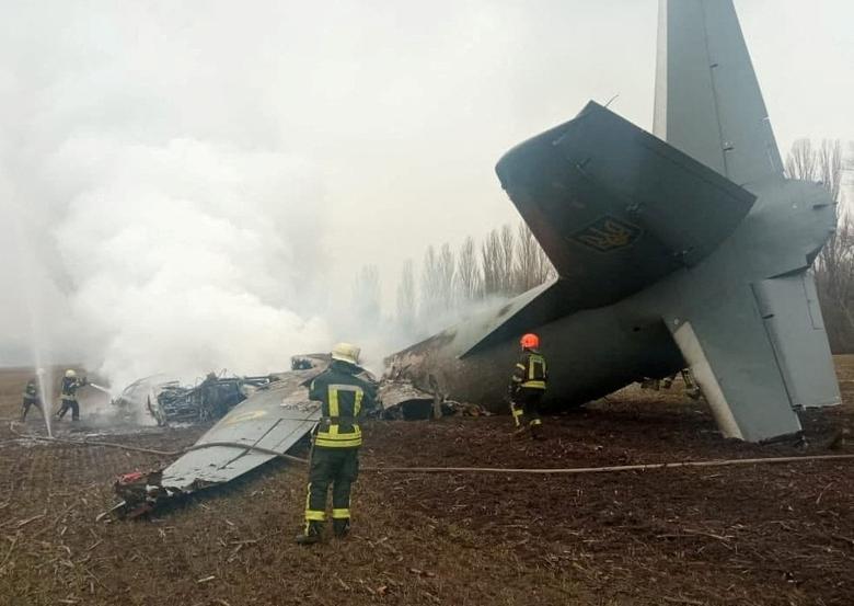 Rescuers work at the crash site of a Ukrainian Armed Forces' Antonov aircraft, which, according to the State Emergency Service, was shot down in the Kyiv region, Ukraine, February 24.