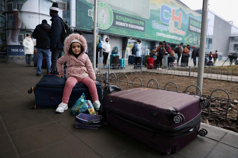 People wait to return to the city at Kyiv Airport, February 24.