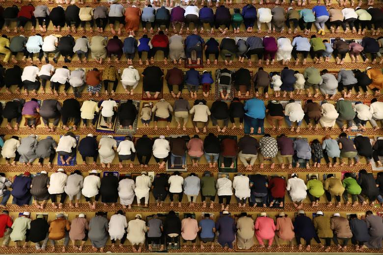 Muslims perform Tarawih prayers to mark the start of Ramadan at a mosque in Singapore April 2.