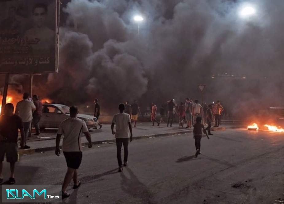 Protesters angry over the area’s crippling electricity shortages set fire to tires in Benghazi, Libya, Sept. 10, 2020.