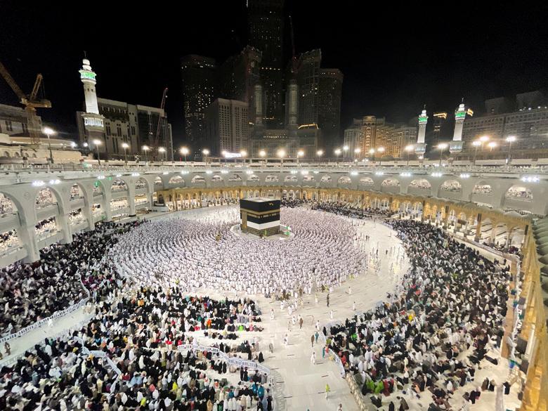 Muslim pilgrims circle the Kaaba and pray at the Grand Mosque as Saudi Arabia welcomes back pilgrims for the 2022 haj season, after the kingdom barred foreign travellers over the last two years because of the coronavirus pandemic, in the holy city of Mec