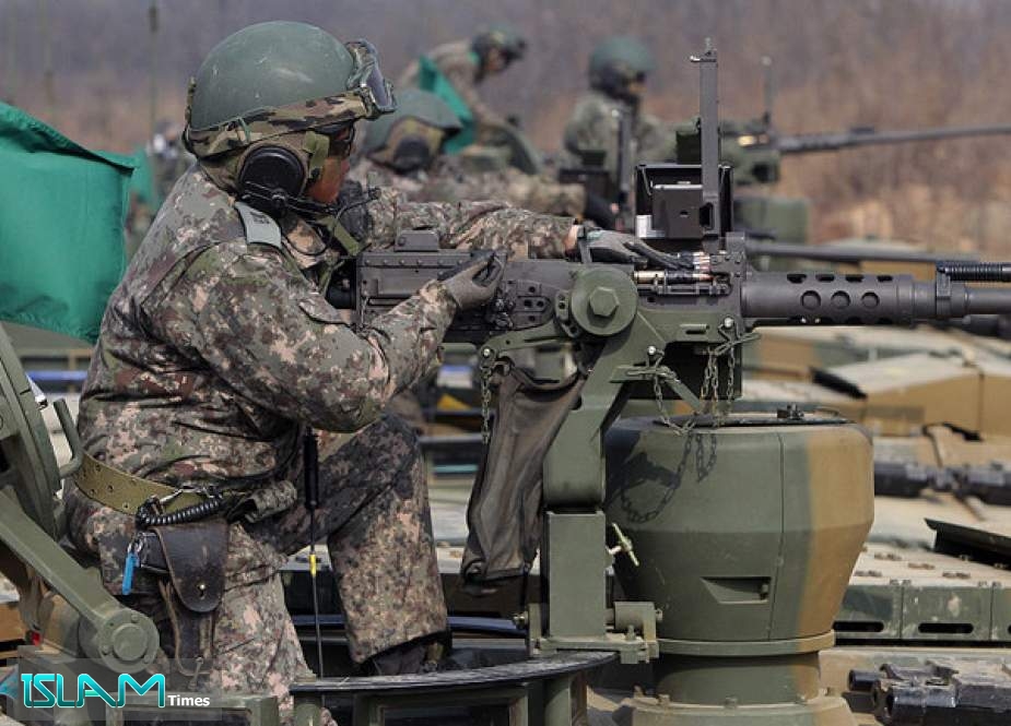 South Korean tank crews are shown taking part in a February 2015 live-fire drill in Gyeonggi province.