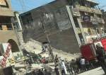 بالصور..انهيار مبنى بالكامل في بغداد  