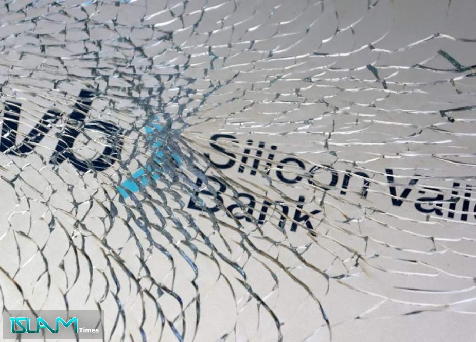 SVB (Silicon Valley Bank) logo is seen through broken glass in this illustration taken March 10, 2023.