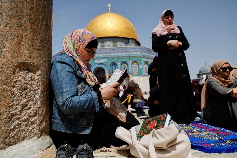 Worshippers pray on the first Friday of the Muslim holy month of Ramadan, in front of the Dome of the Rock, on the compound known to Muslims as the Noble Sanctuary in Jerusalem