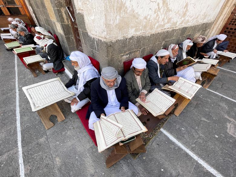 People read the Quran at the Grand Mosque ahead of the fasting month of Ramadan in Sanaa, Yemen, March 22, 2023.