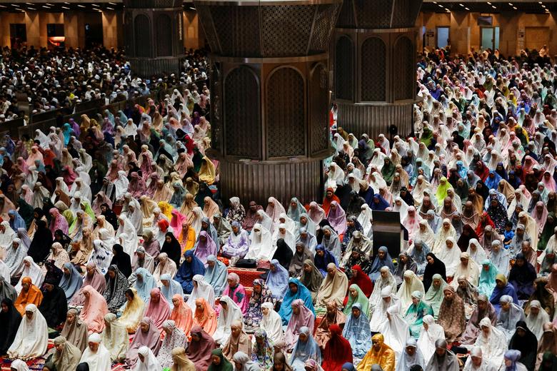 Muslim women attend mass prayers known as Tarawih during the first eve of Ramadan at the Great Mosque of Istiqlal in Jakarta, Indonesia, March 22, 2023.