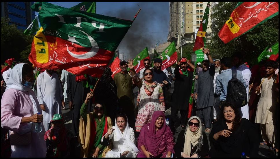 Pakistan Tehreek-e-Insaf party activists and supporters of Imran block road during a protest against the arrest of their leader in Karachi, May 09, 2023