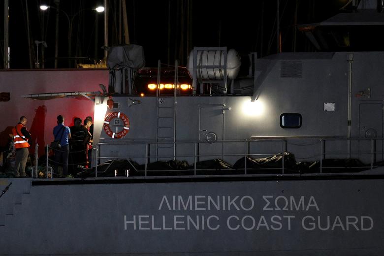 Body bags carrying migrants who died after their boat capsized in the open sea off Greece, are seen onboard a Hellenic Coast Guard vessel at the port of Kalamata, Greece, June 14.