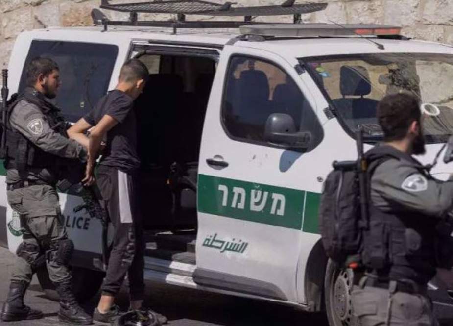 Israeli security forces arrest a Palestinian outside Al-Quds