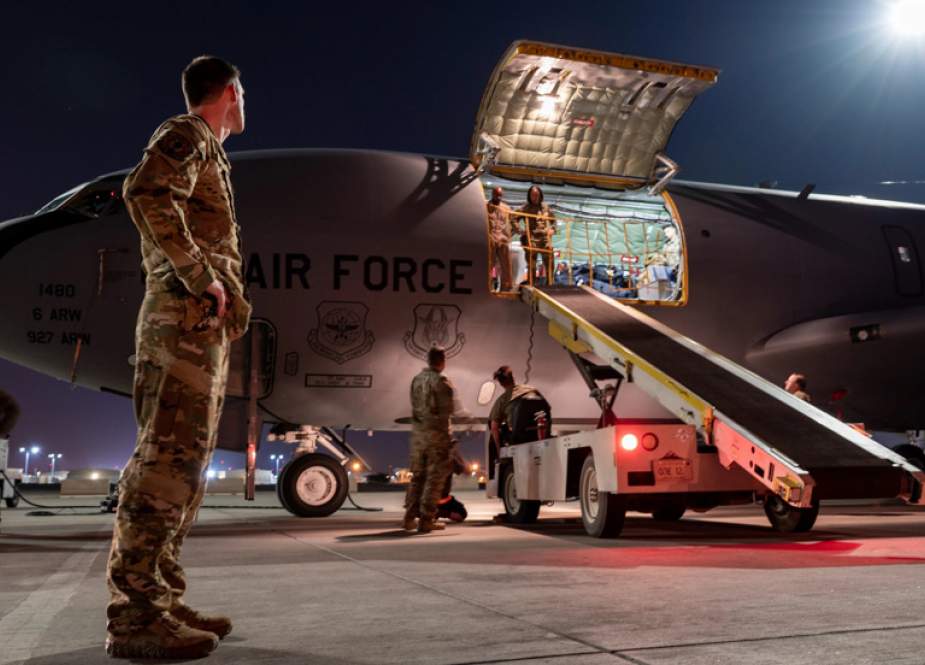 US Air Force personnel unload a KC-135 Stratotanker at an undisclosed location
