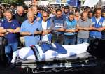 Pray over the body of Palestine TV journalist Mohammed Abu Hatab who was killed in an Israeli Strike in Khan Younis, in the southern Gaza Strip