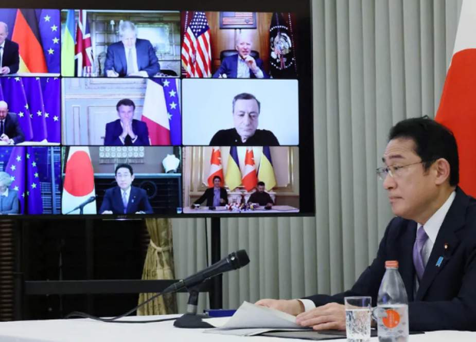 Japanese Prime Minister Fumio Kishida looks on during a virtual meeting with other G7 leaders