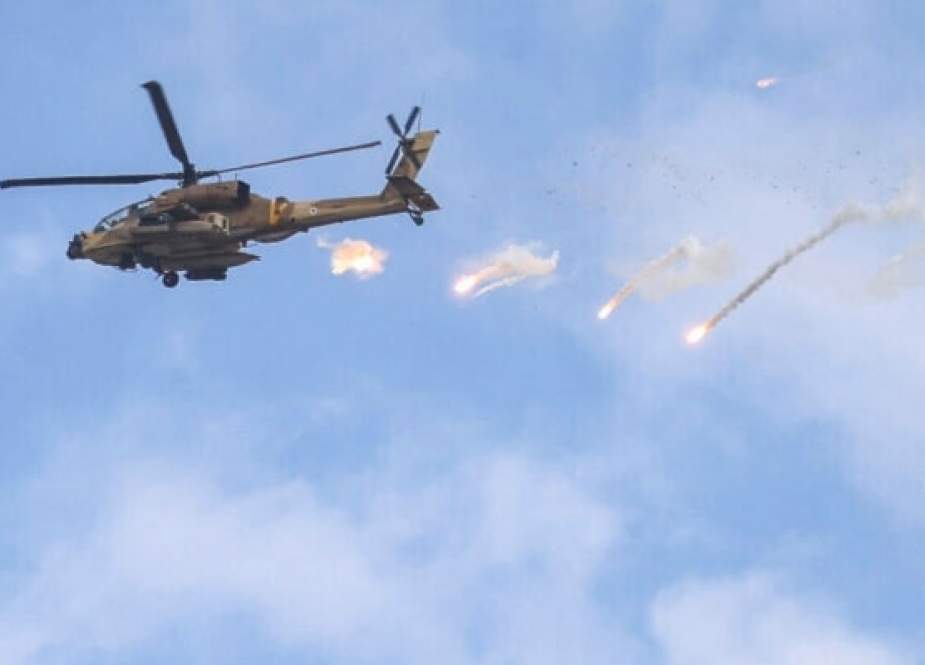 Israeli Air Force AH-64 Apache attack helicopter releases flares during a raid in Jenin in the occupied West Bank