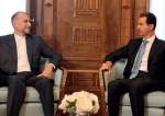 Iranian Foreign Minister Hossein Amir-Abdollahian (L) meets Syrian President Bashar al-Assad in the capital Damascus