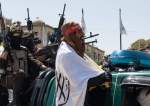 Taliban supporters hold a parade to mark two years since the group
